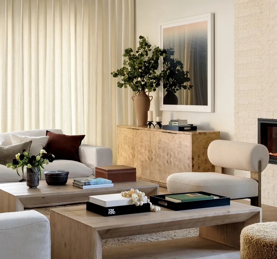Elegant, freshly cleaned living room with a sofa, coffee table and plants